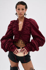IN IT TO WIN IT RUCHED BLOUSE IN BURGUNDY